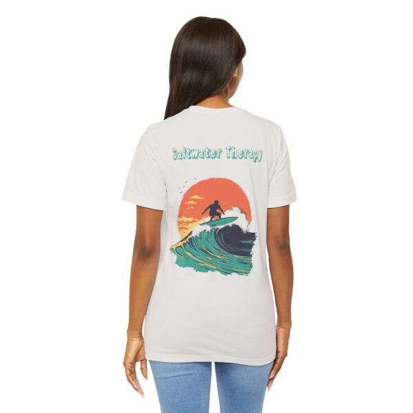 Illustration of a surfer riding a large wave at sunset with the text ‘Saltwater Therapy’ above the scene.